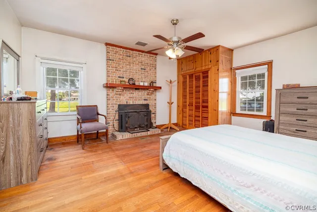 a spacious bedroom with a bed and a fireplace