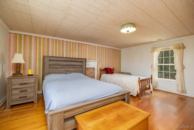 a bed room with a bed and a television