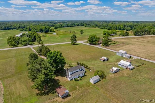 an aerial view of a houses with outdoor space