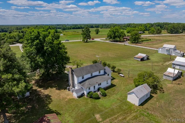 an aerial view of a house with a lake view