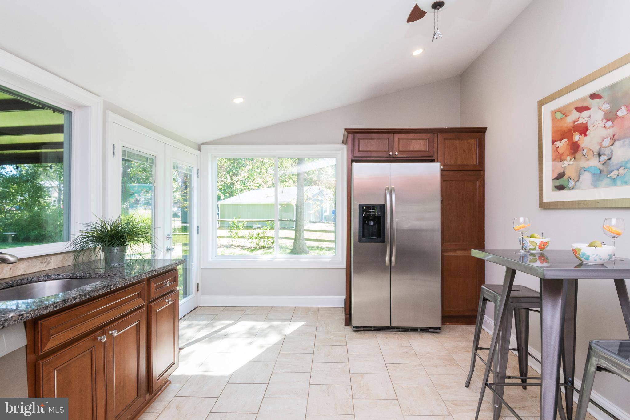 9353 Torrent Row Columbia, MD 21045 - Photo 14 of 40 Cherry cabinetry and tile floors