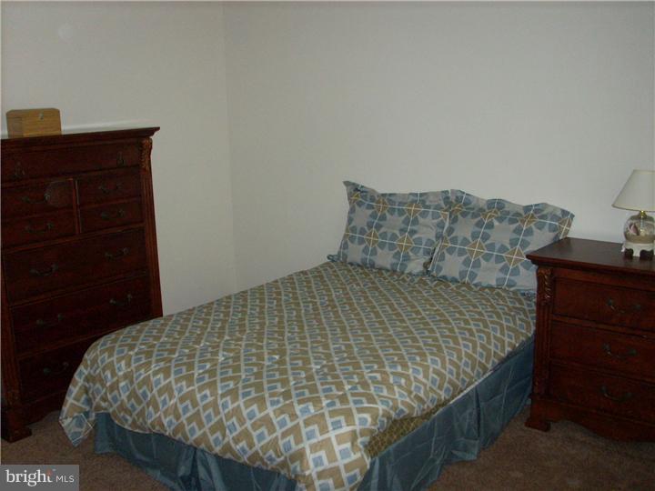 711 Rutland Court Sewell, NJ 08080 - Photo 11 of 18 a bed sitting in a bedroom next to a dresser with a dresser