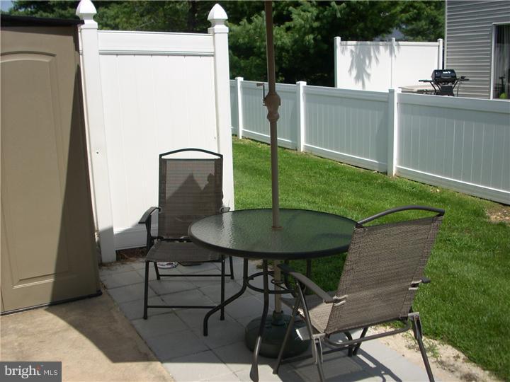 711 Rutland Court Sewell, NJ 08080 - Photo 13 of 18 a backyard of a house with table and chairs