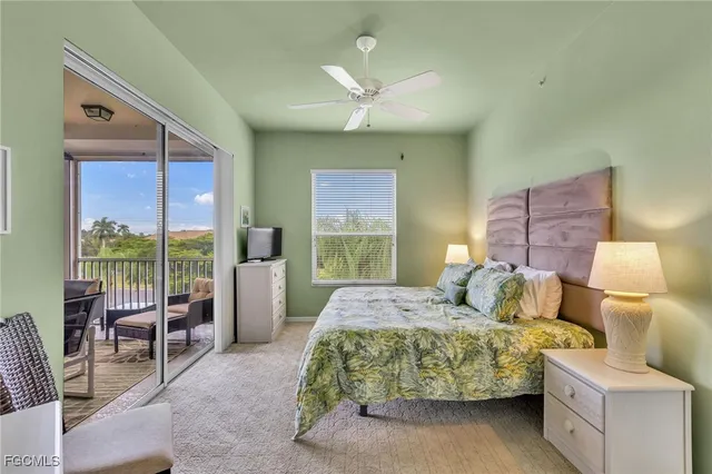 a bedroom with a large bed and a large window