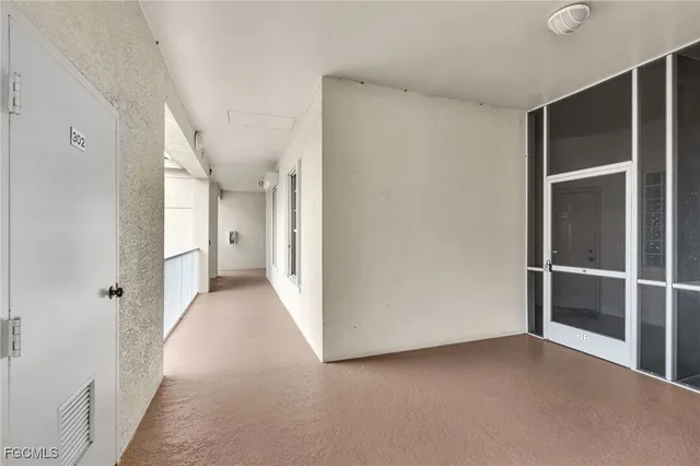 a view of a balcony with two chairs and a table