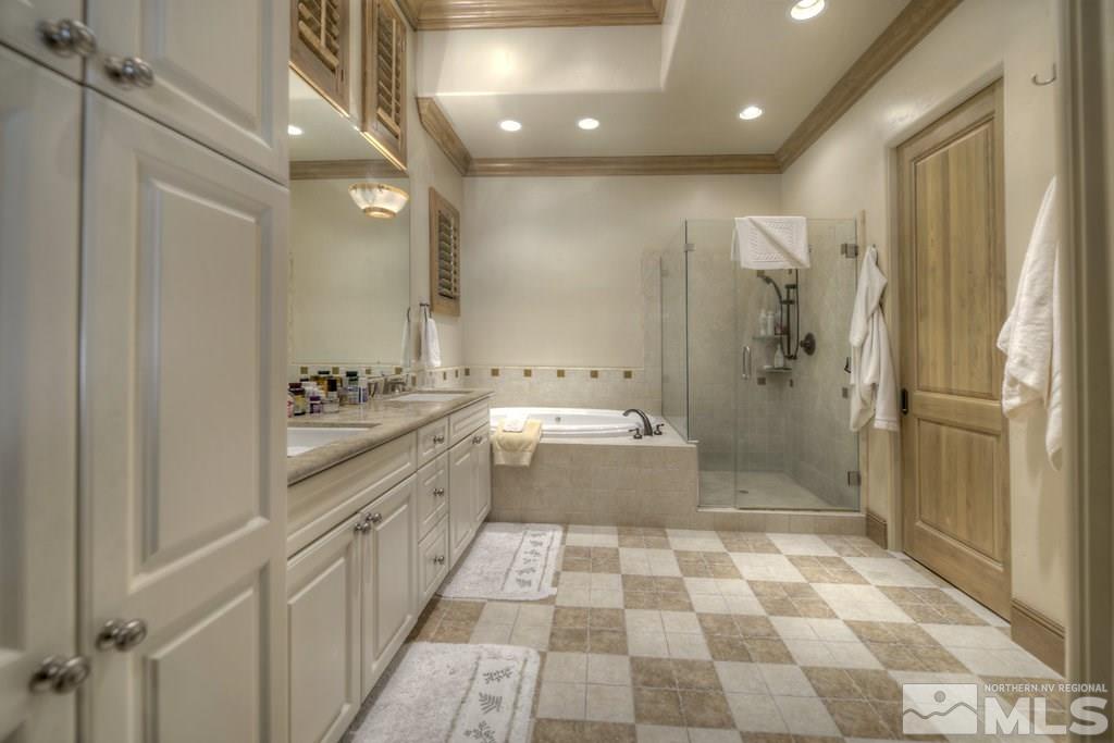 6330 Wetzel Court Reno, NV 89511 - Photo 16 of 25 a bathroom with a sink a toilet and shower