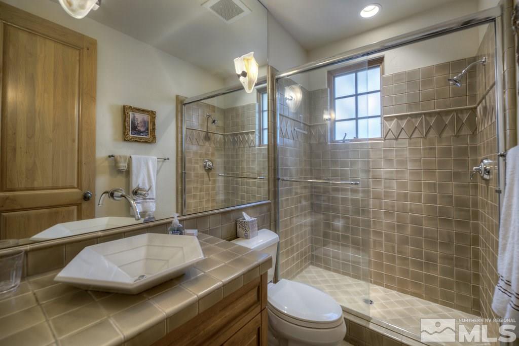 6330 Wetzel Court Reno, NV 89511 - Photo 20 of 25 a bathroom with a sink a toilet and shower