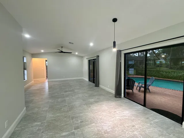 a view of a hallway with an entryway