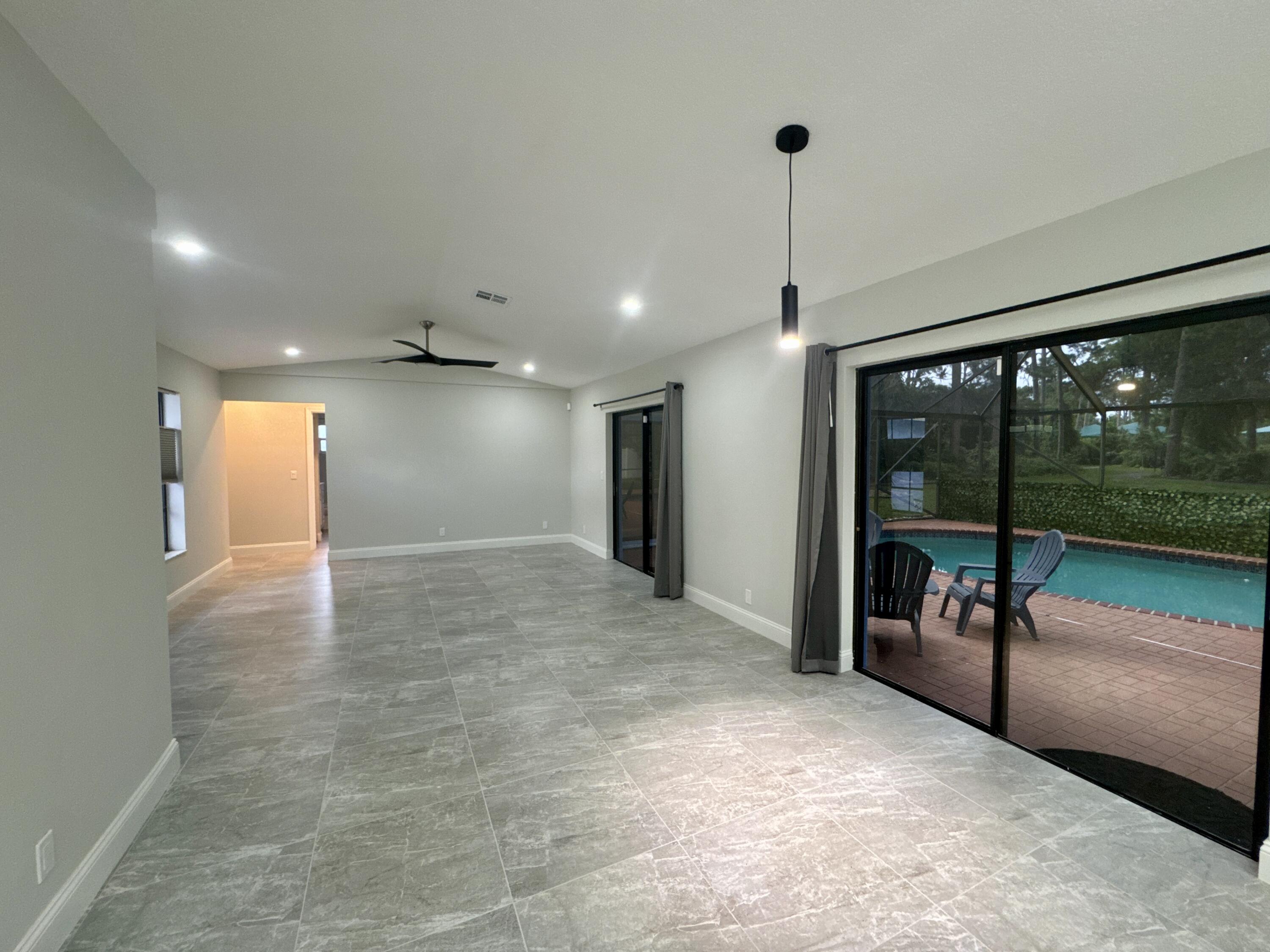 4160 Northwest 7th Court Delray Beach, FL 33445 - Photo 14 of 46 a view of a hallway with an entryway