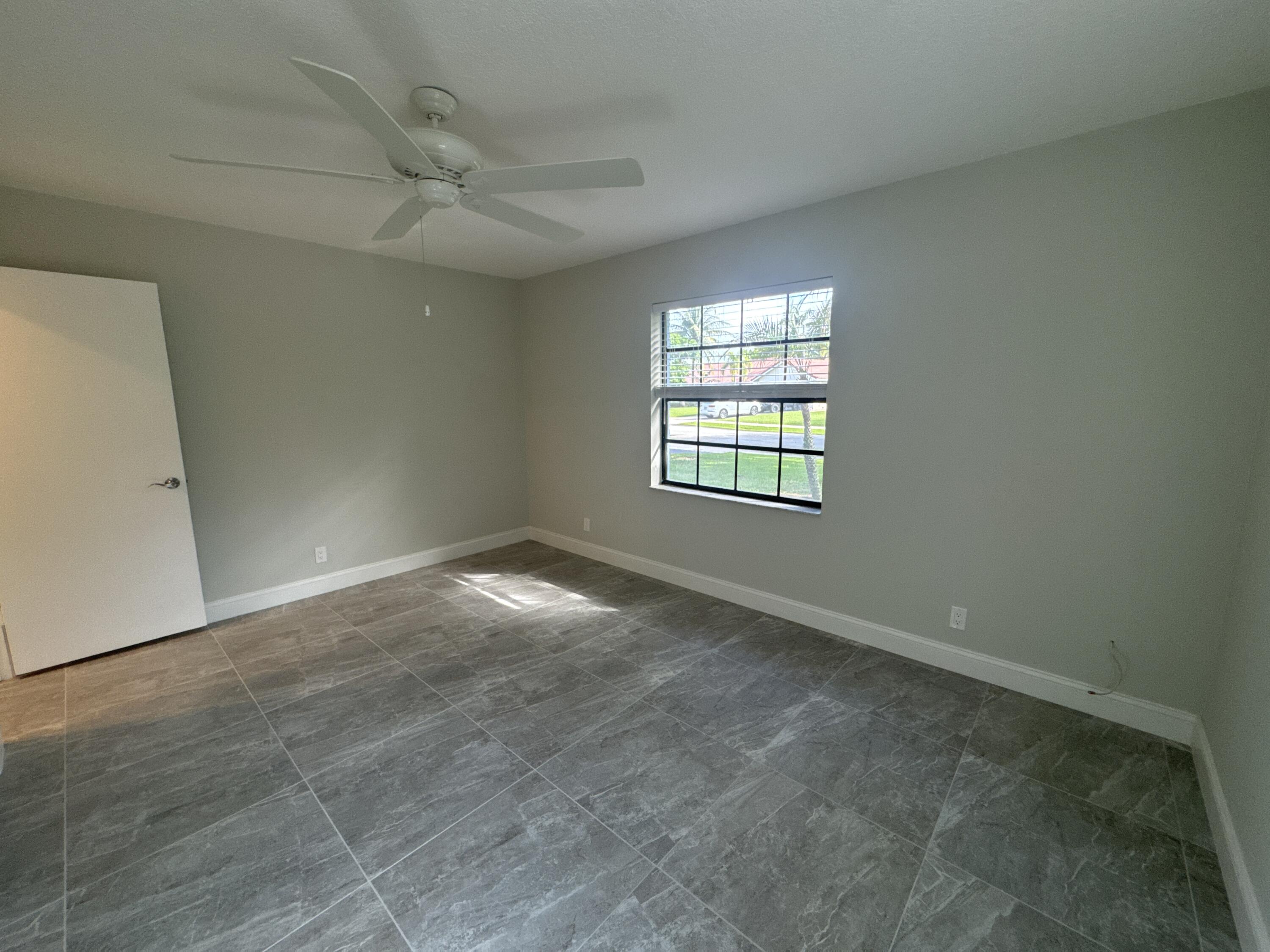 4160 Northwest 7th Court Delray Beach, FL 33445 - Photo 25 of 46 an empty room with a window