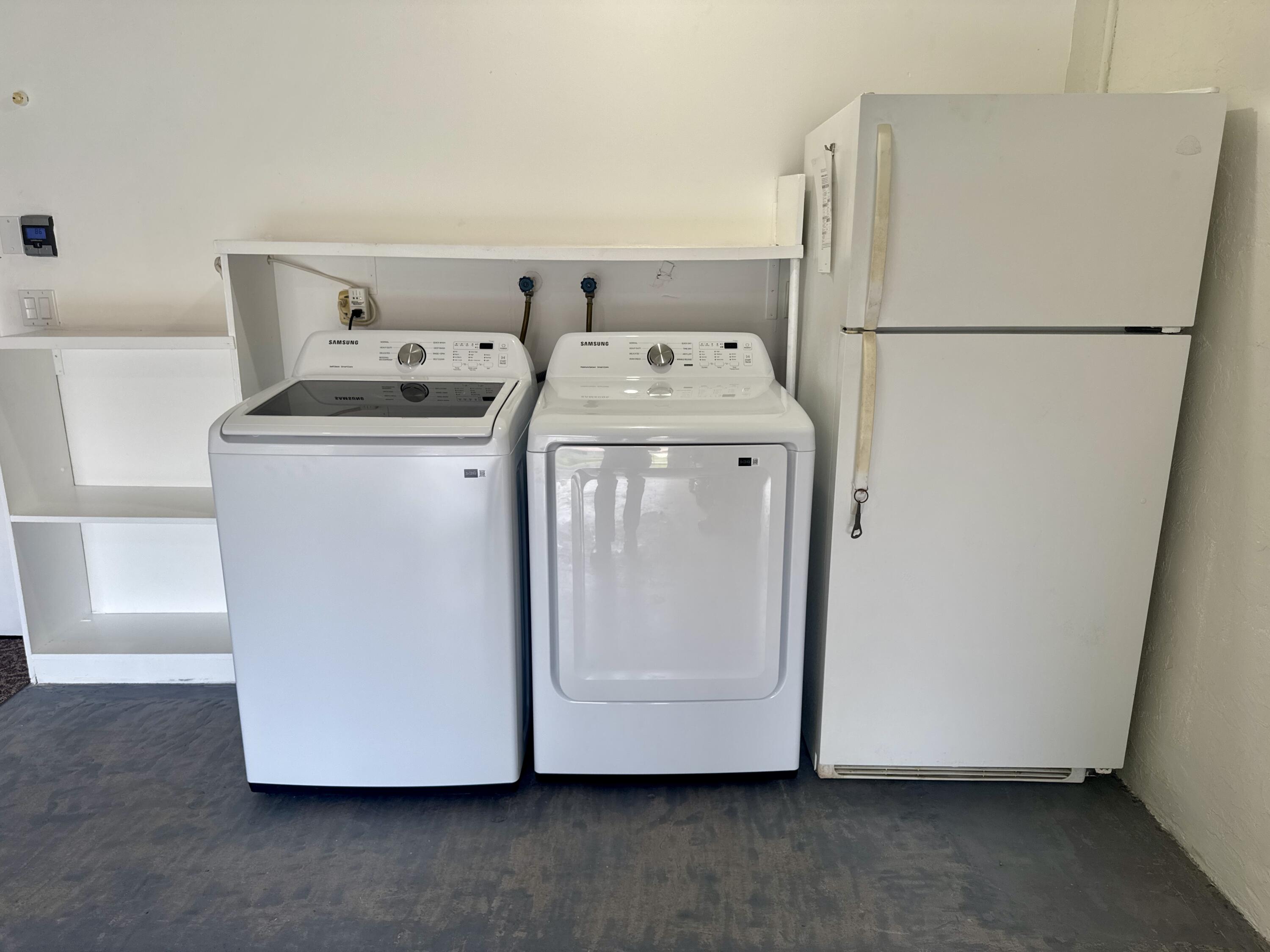 4160 Northwest 7th Court Delray Beach, FL 33445 - Photo 30 of 46 a utility room with dryer and washer