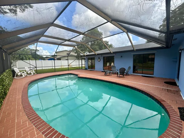 a view of a swimming pool with a patio