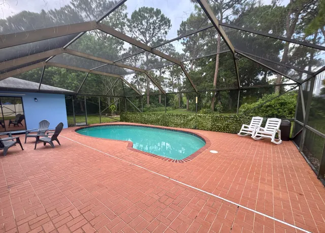 a view of swimming pool with a backyard