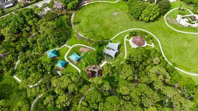 an aerial view of a house with a yard and garden
