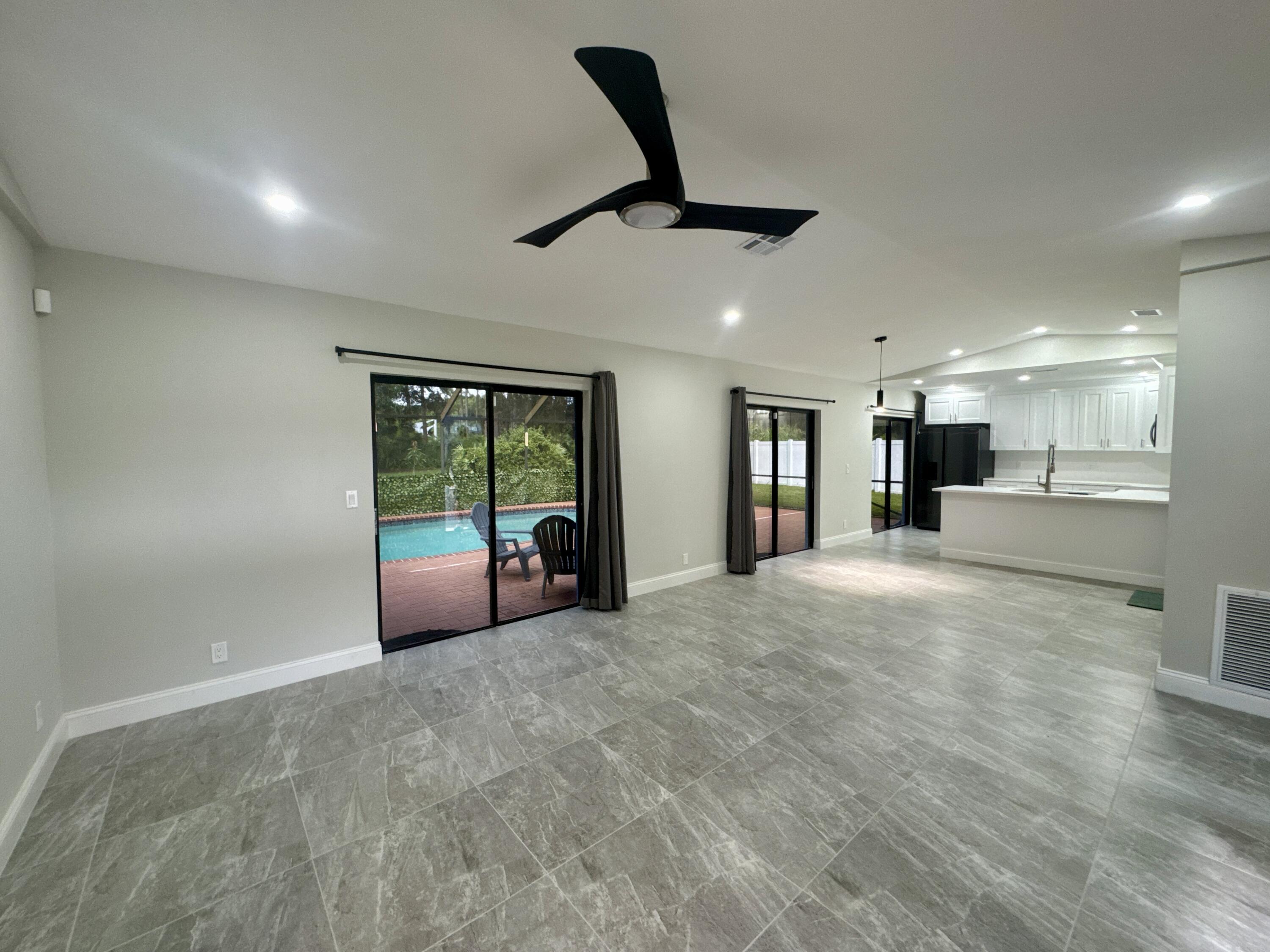 4160 Northwest 7th Court Delray Beach, FL 33445 - Photo 7 of 46 a view of an empty room with a window