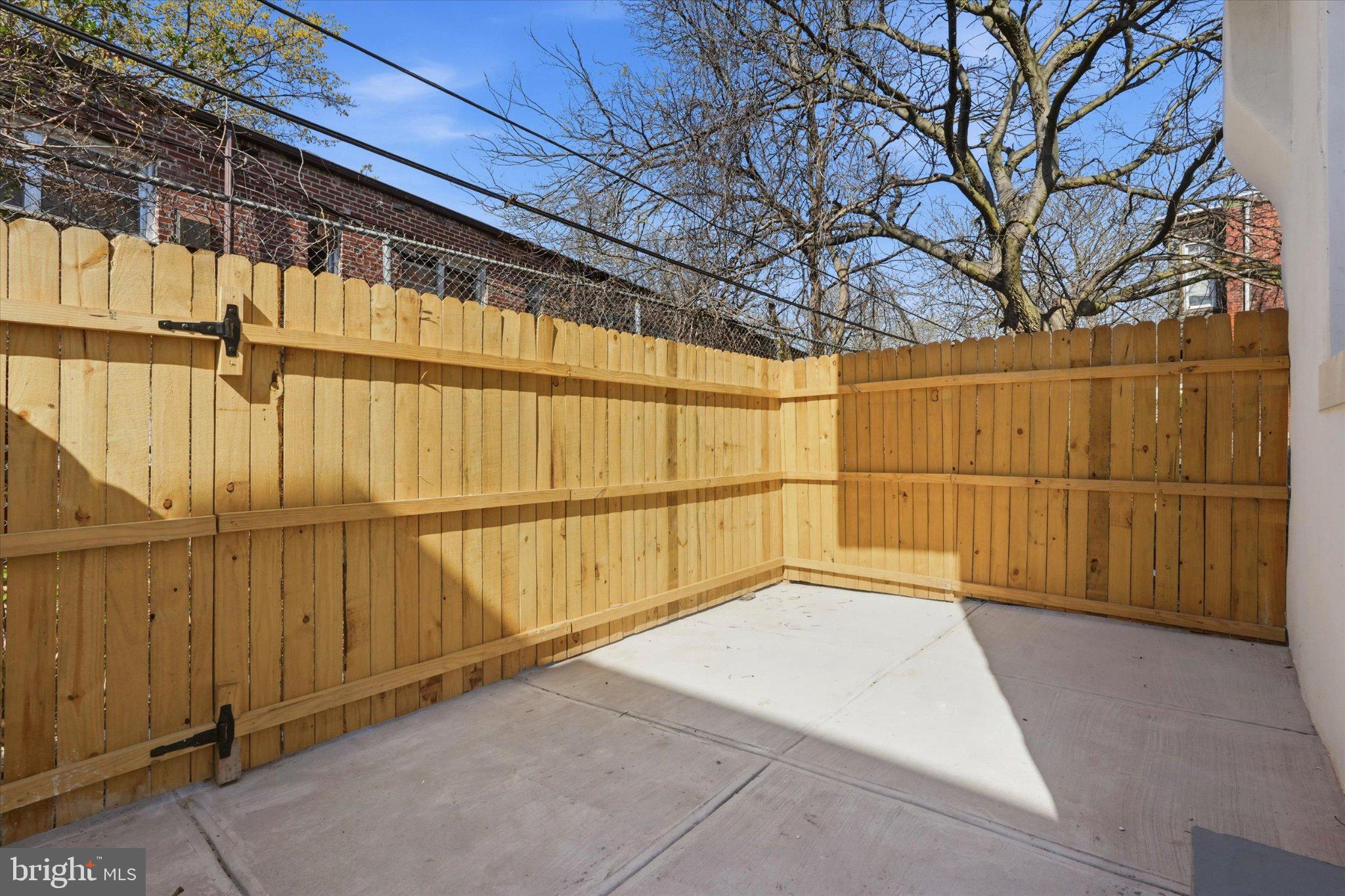 2528 Page Street Philadelphia, PA 19121 - Photo 15 of 15 Private outdoor retreat with wooden fence.