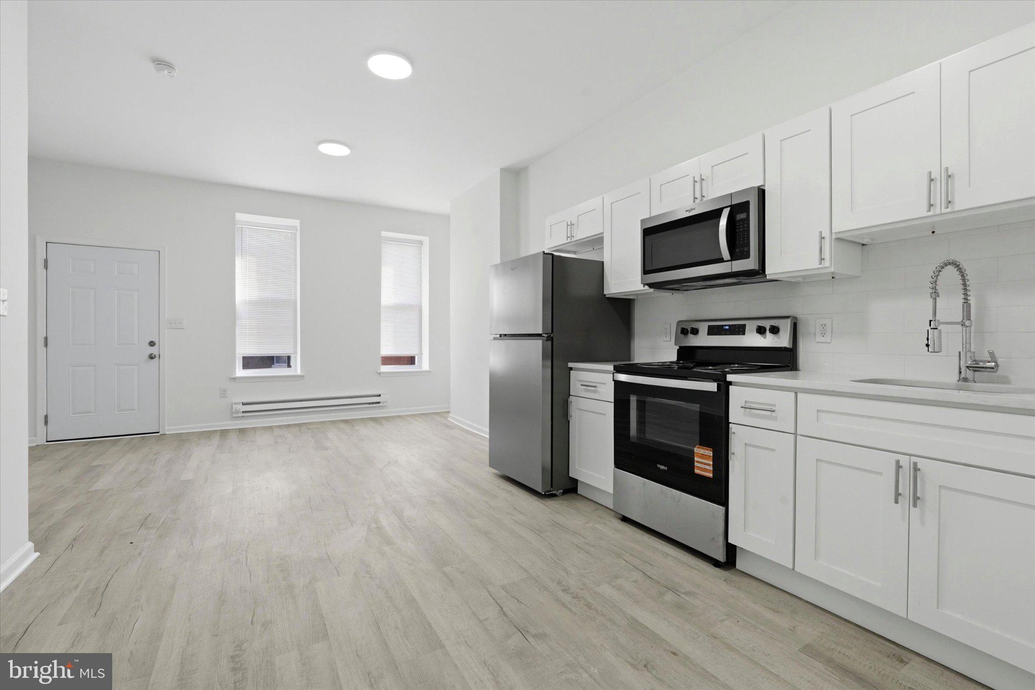 2528 Page Street Philadelphia, PA 19121 - Photo 3 of 15 Modern kitchen with sleek finishes.