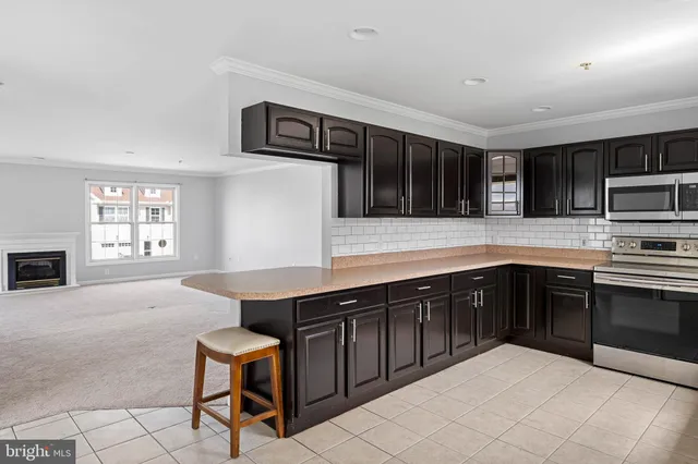 a kitchen with stainless steel appliances granite countertop a sink and cabinets