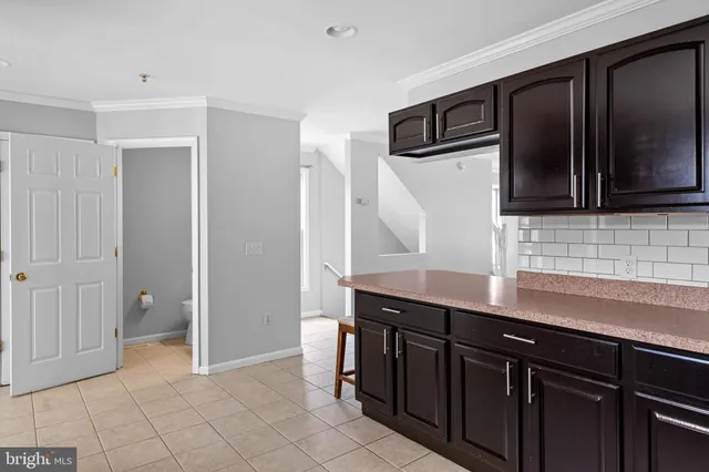 a kitchen with stainless steel appliances a sink and cabinets