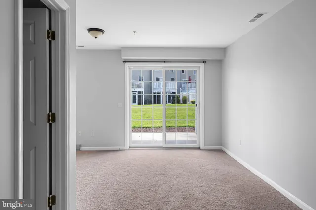 an empty room with a window and outside view