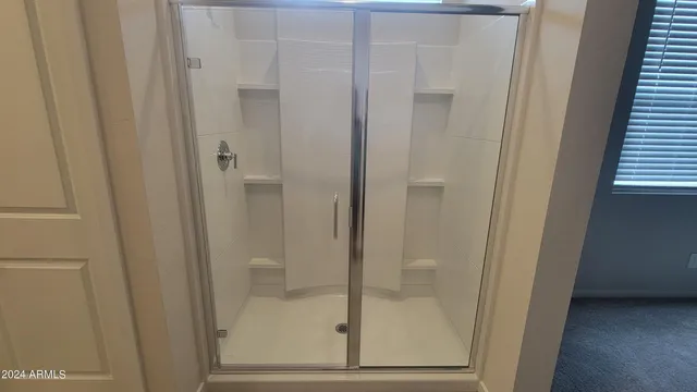 a bathroom with a glass door