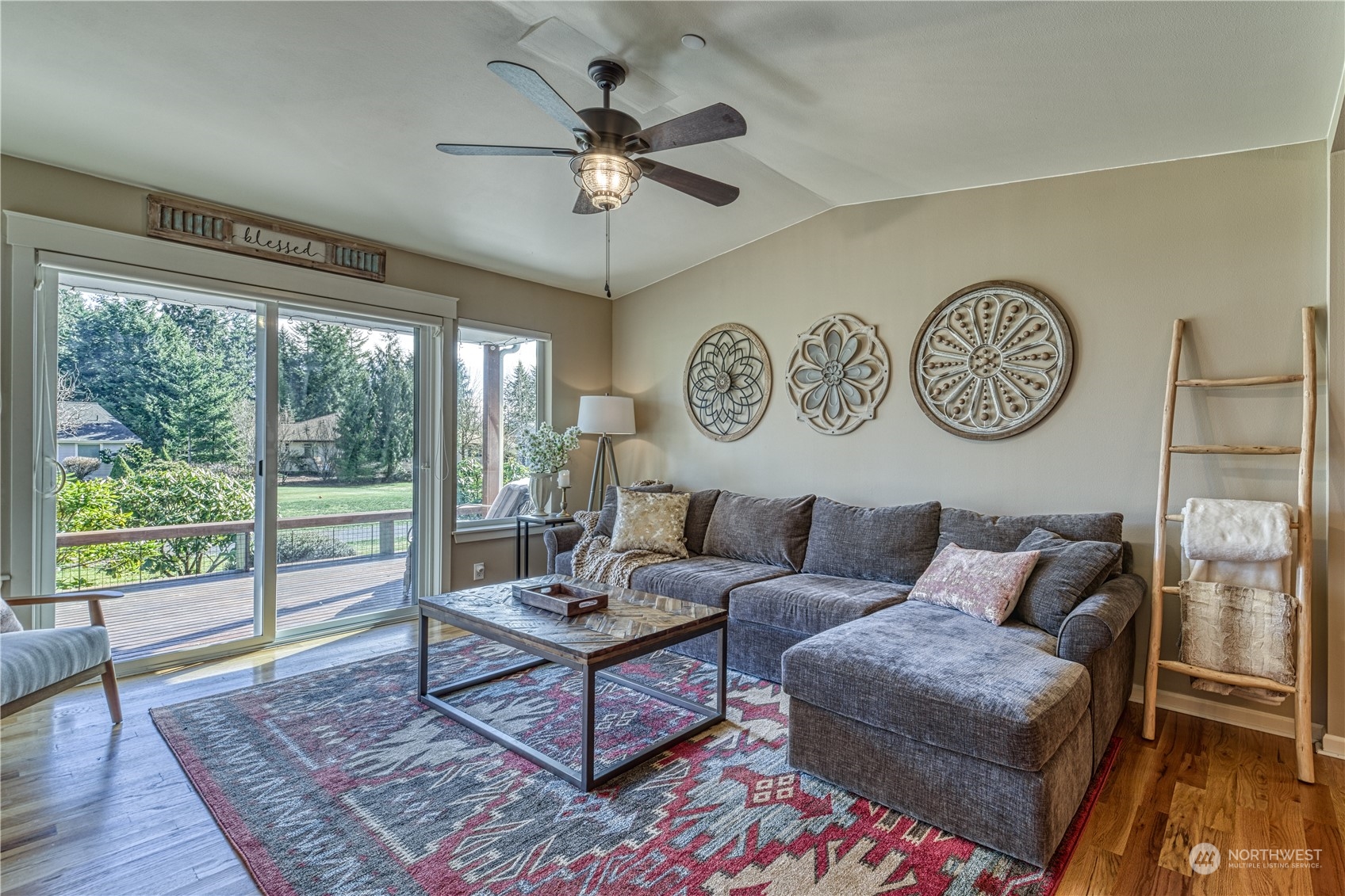 91 East Soderberg Road, Unit B5 Allyn, WA 98524 - Photo 12 of 34 a living room with furniture and a large window