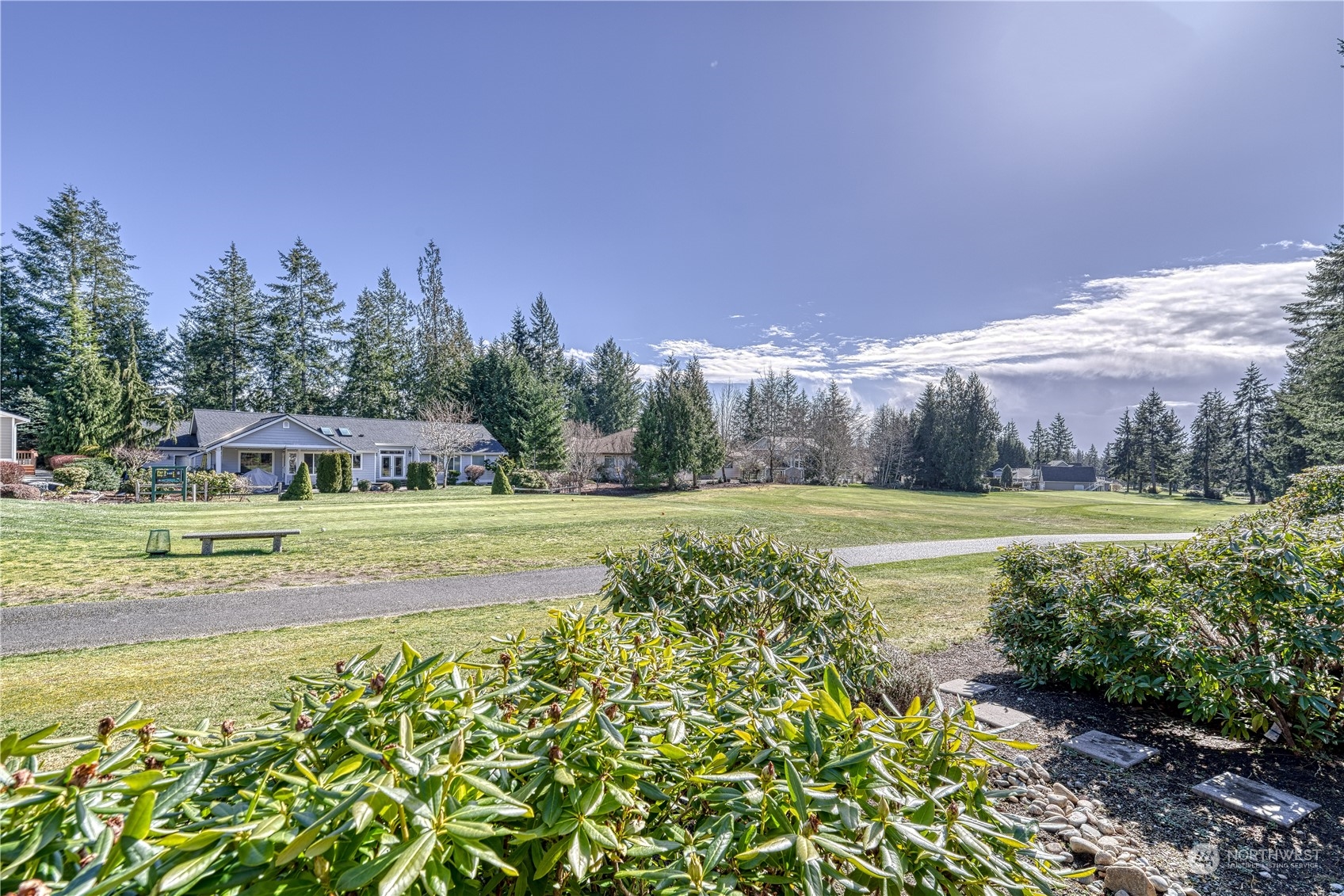 91 East Soderberg Road, Unit B5 Allyn, WA 98524 - Photo 15 of 34 a view of a house with a big yard