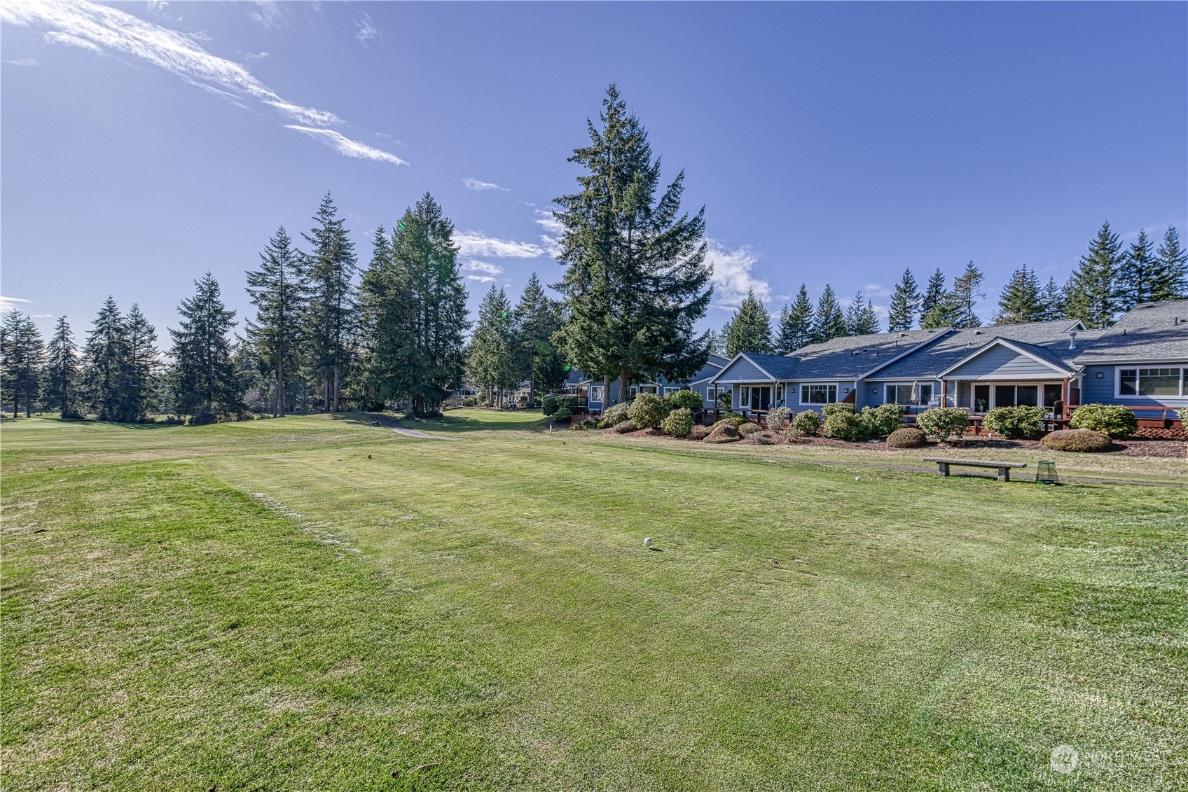 91 East Soderberg Road, Unit B5 Allyn, WA 98524 - Photo 16 of 34 a view of outdoor space with garden and trees