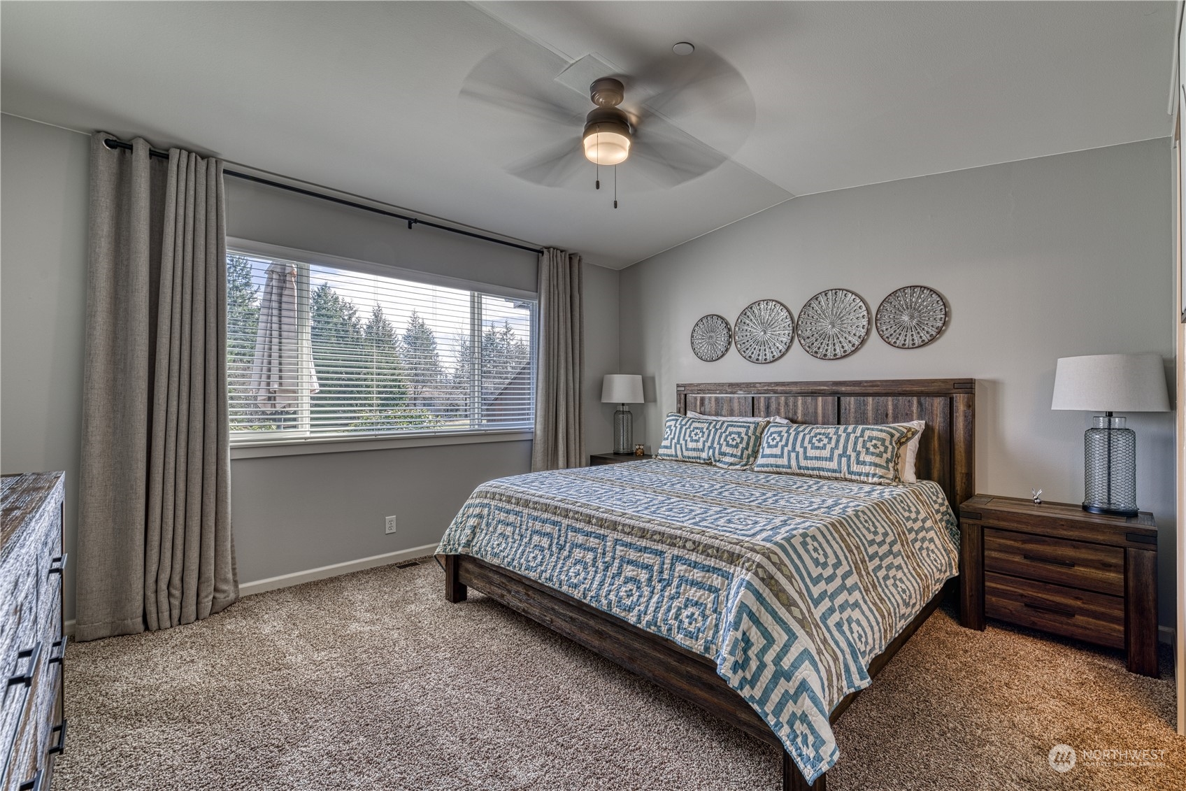 91 East Soderberg Road, Unit B5 Allyn, WA 98524 - Photo 18 of 34 a bedroom with a bed and a window