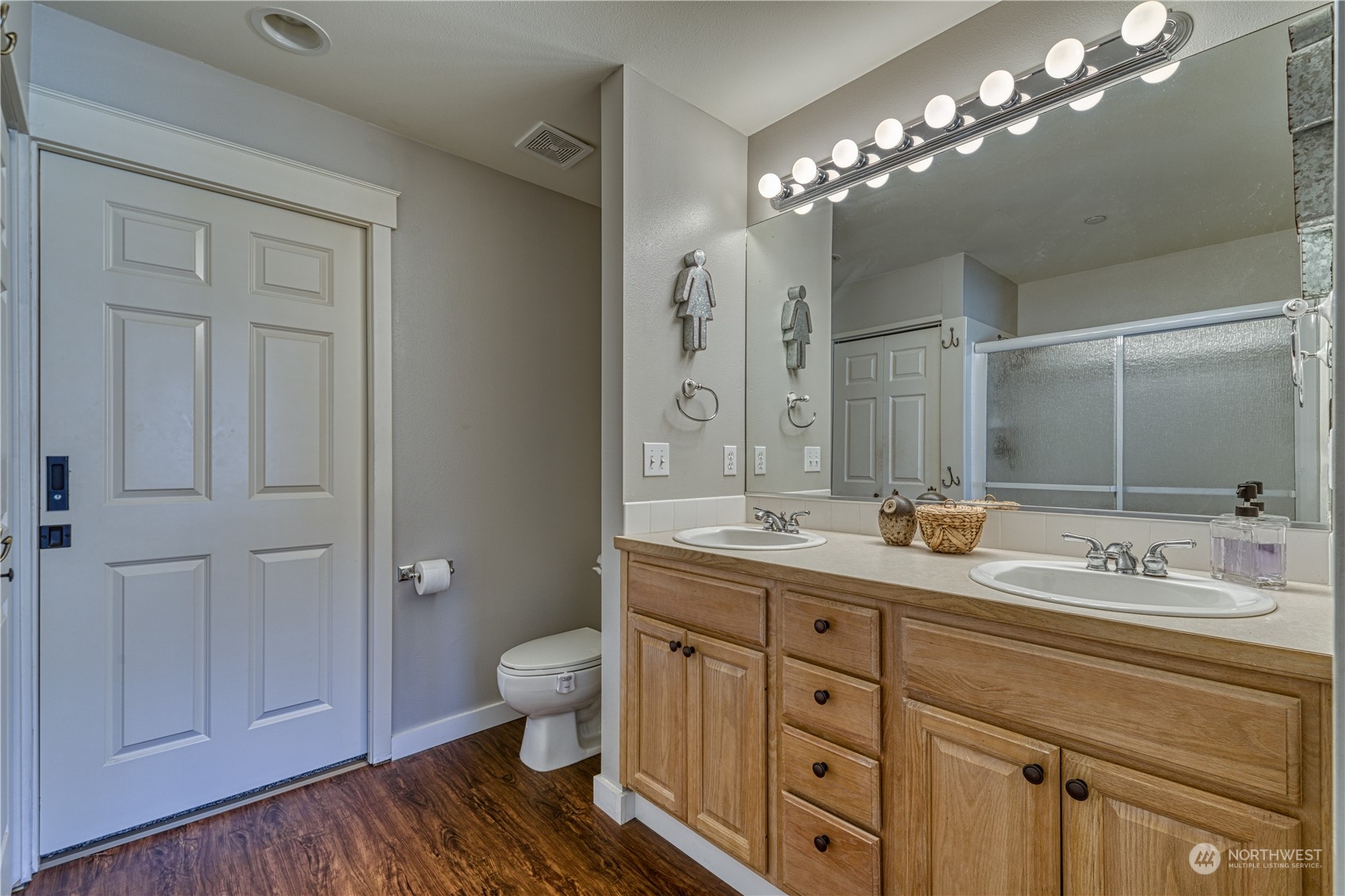 91 East Soderberg Road, Unit B5 Allyn, WA 98524 - Photo 21 of 34 a bathroom with a double vanity sink and a mirror