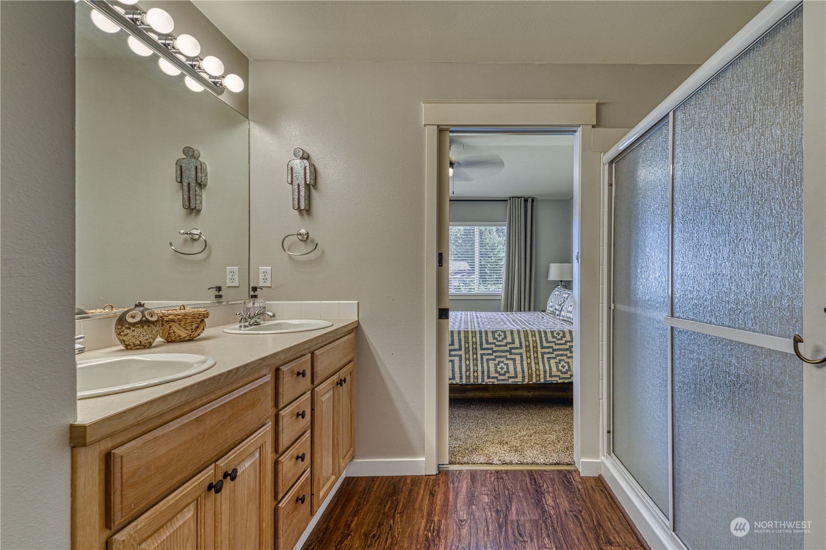 91 East Soderberg Road, Unit B5 Allyn, WA 98524 - Photo 22 of 34 a en suite bathroom with a granite countertop sink and a mirror