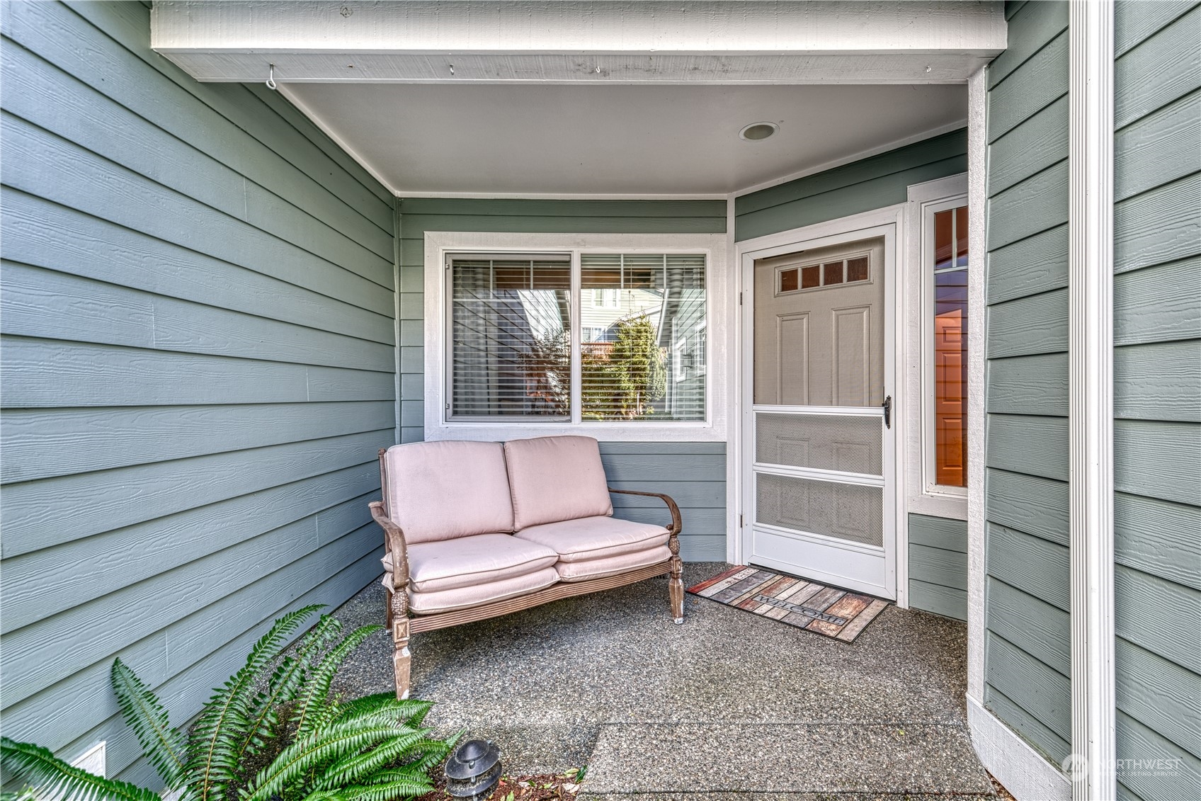 91 East Soderberg Road, Unit B5 Allyn, WA 98524 - Photo 3 of 34 a house view with a outdoor space