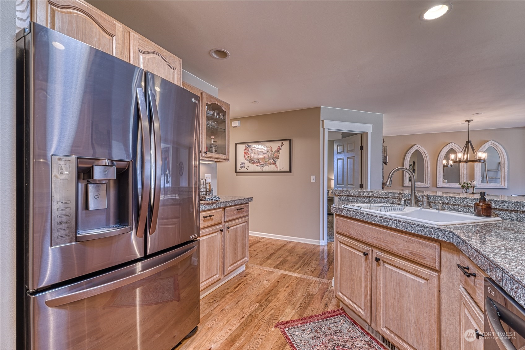 91 East Soderberg Road, Unit B5 Allyn, WA 98524 - Photo 7 of 34 a kitchen with stainless steel appliances granite countertop a refrigerator and a sink