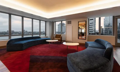 a dining room with furniture and window