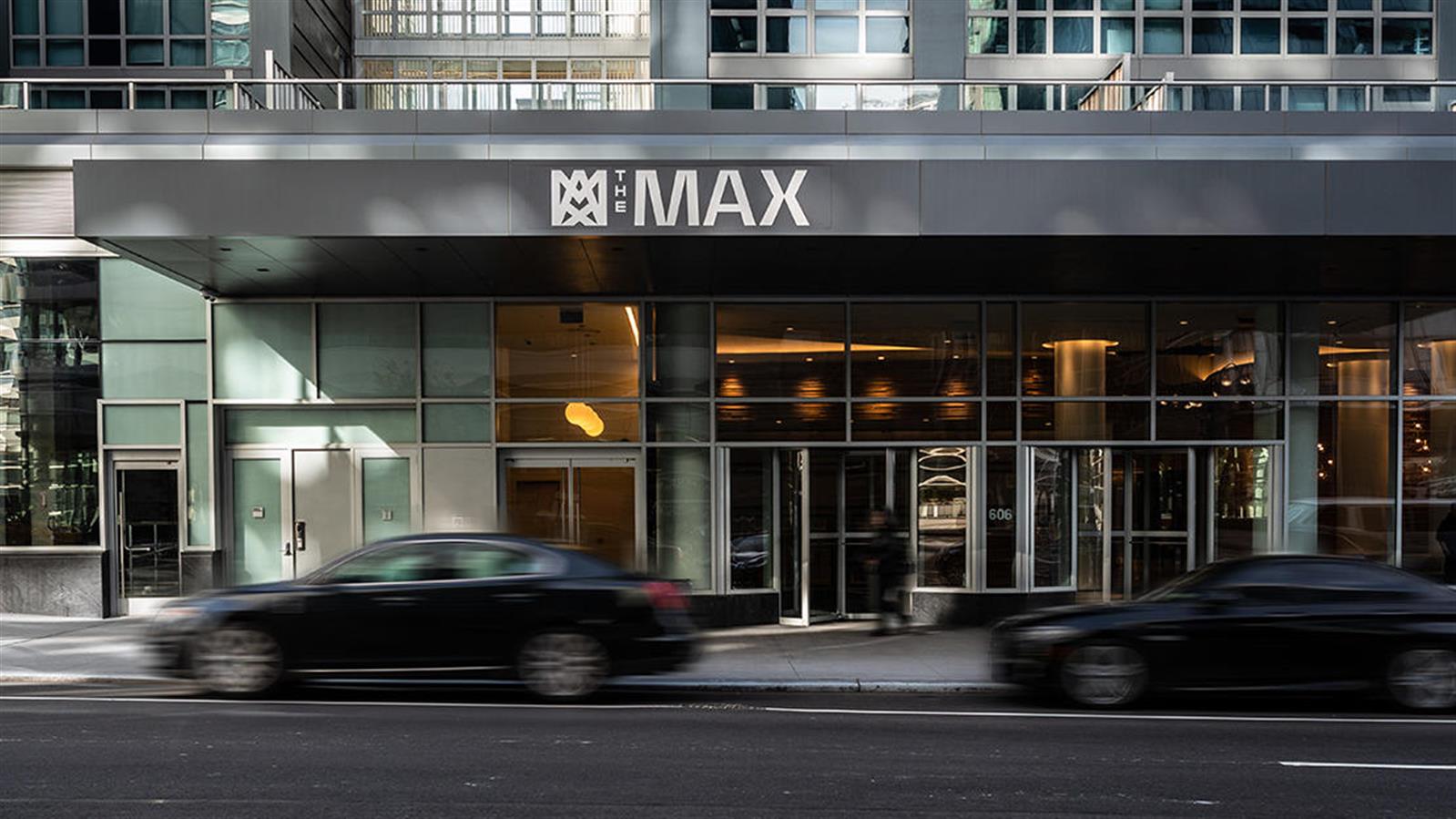 606 West 57th Street, Unit 1438 Manhattan, NY 10019 - Photo 22 of 23 a black car parked in front of a building