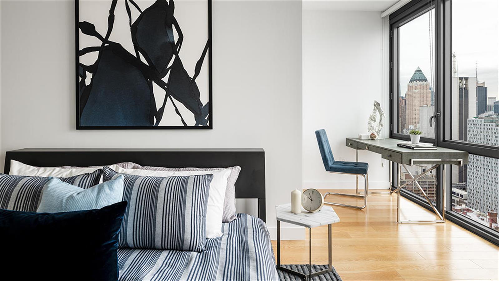 606 West 57th Street, Unit 1438 Manhattan, NY 10019 - Photo 3 of 23 a view of table and chairs in room