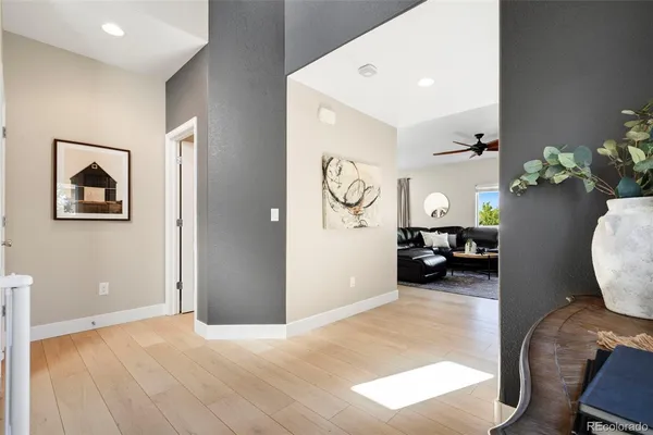 a view of a livingroom with furniture and wooden floor