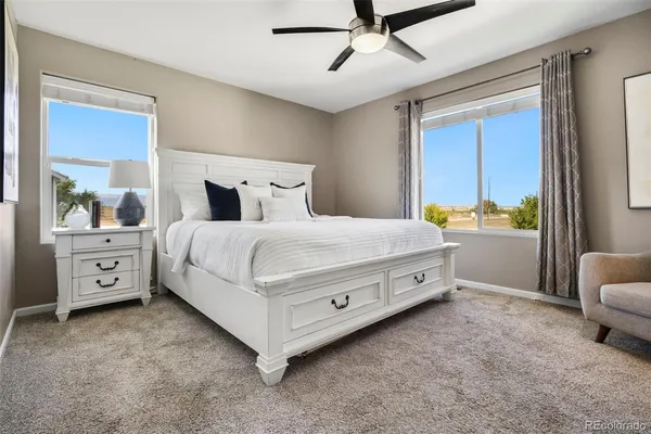 a bedroom with a bed and a couch