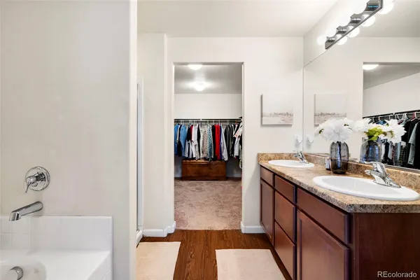 a bathroom with a sink double vanity and a mirror