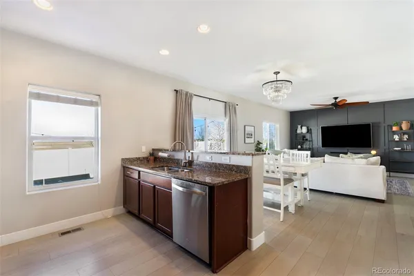 a view of living room with furniture and flat screen tv