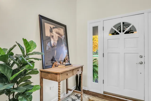 a view of a living room with furniture and a large window
