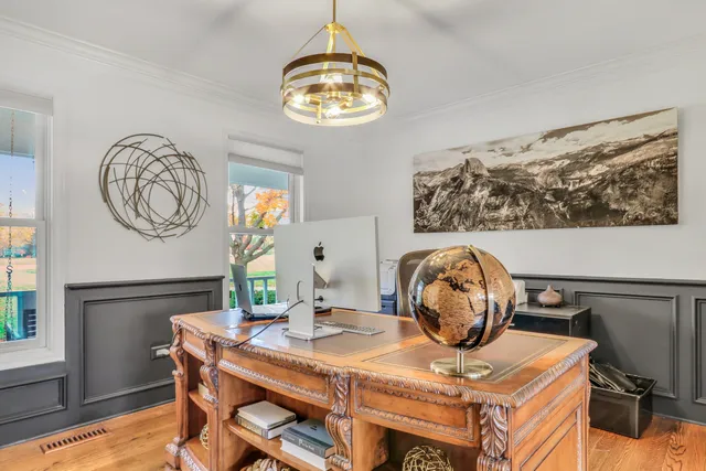 a living room with fireplace furniture and a flat screen tv