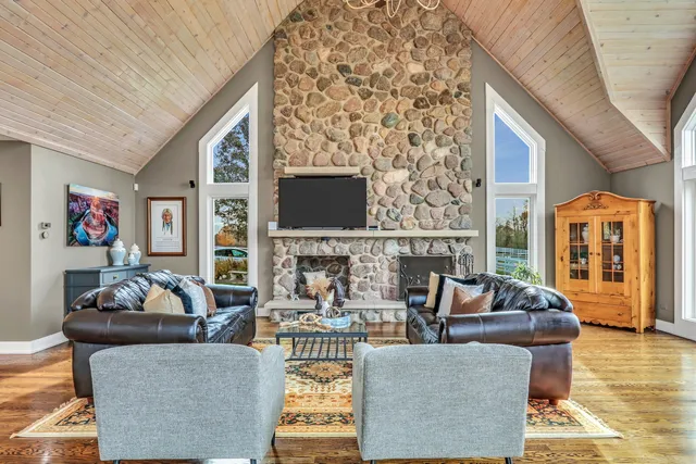 a kitchen with a sink a stove and chairs
