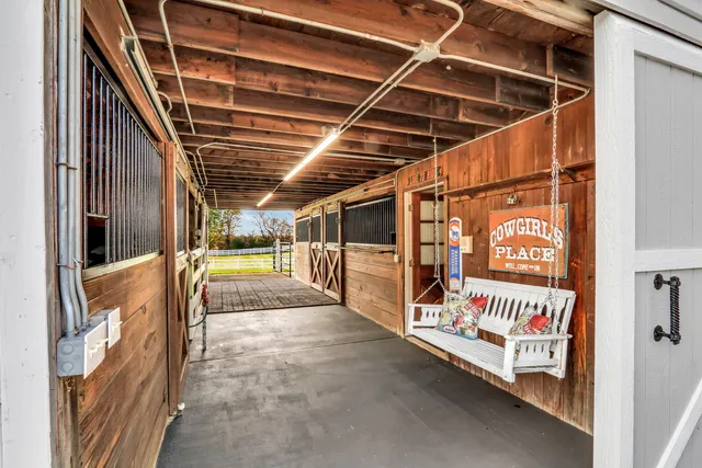 a view of a hallway with paintings on the wall