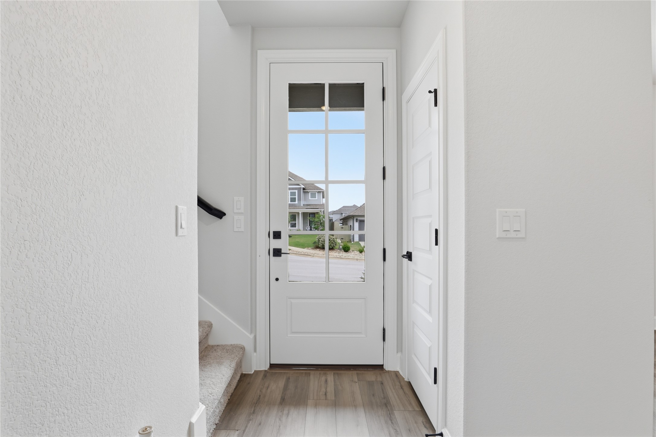 9320 Gladsome Path Manor, TX 78653 - Photo 8 of 34 a view of a hallway with wooden floor and closet
