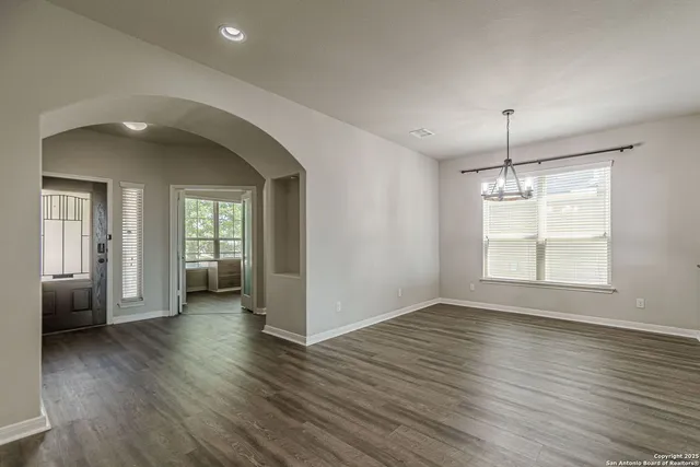 a kitchen with granite countertop a sink and a window