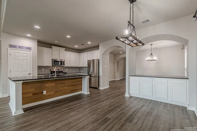 a bathroom with a double vanity sink and mirror