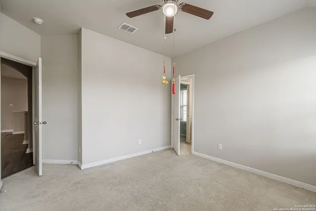 a view of a balcony with a barbeque