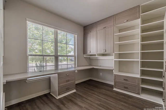 a bathroom with a sink toilet and mirror
