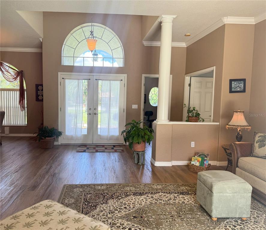 7552 River Country Drive Weeki Wachee, FL 34607 - Photo 18 of 59 a living room with furniture and a large window